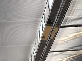 Supply air flows through slot diffusers
